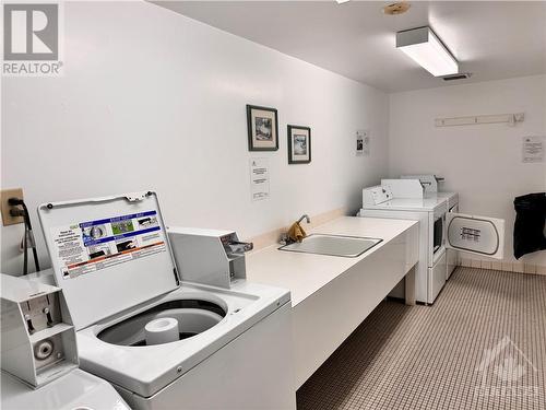 Laundry on every floor! - 3100 Carling Avenue Unit#907, Ottawa, ON - Indoor Photo Showing Laundry Room