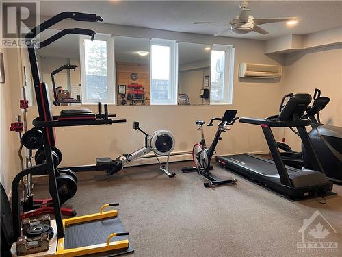 Fitness room. - 3100 Carling Avenue Unit#907, Ottawa, ON - Indoor Photo Showing Gym Room