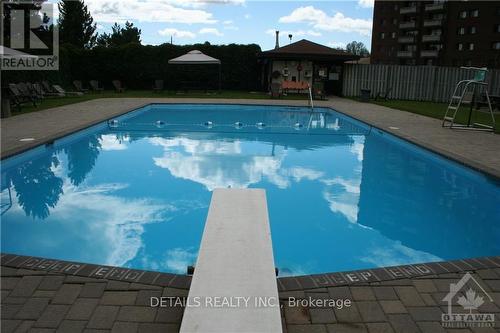 907 - 3100 Carling Avenue, Ottawa, ON - Outdoor With In Ground Pool