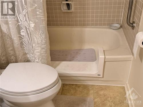 Bathtub has been cut to allow easy access. How convenient is that! - 3100 Carling Avenue Unit#907, Ottawa, ON - Indoor Photo Showing Bathroom