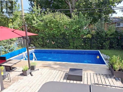 Backyard summer time - 1221 Amesbrooke Drive, Ottawa, ON - Outdoor With In Ground Pool With Deck Patio Veranda