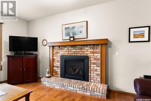 19 Sapphire Drive, Emerald Park, SK - Indoor Photo Showing Living Room With Fireplace