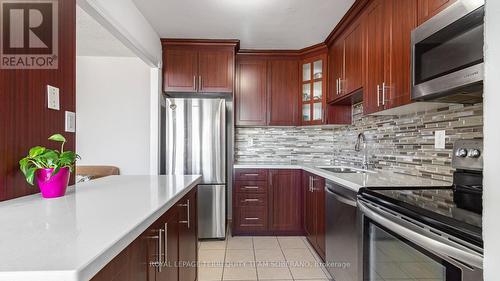 2002 - 3590 Kaneff Crescent, Mississauga, ON - Indoor Photo Showing Kitchen With Upgraded Kitchen