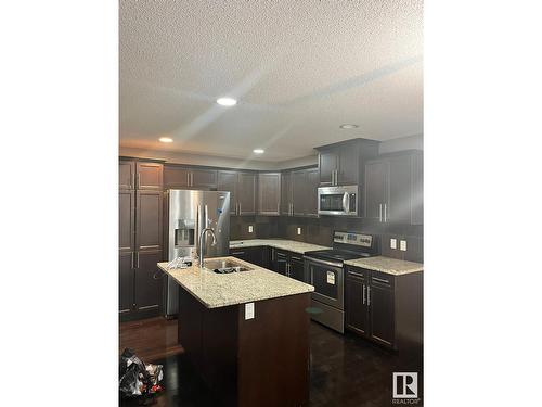 16811 51 St Nw, Edmonton, AB - Indoor Photo Showing Kitchen With Double Sink With Upgraded Kitchen