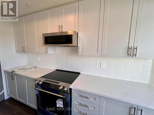 103 - 1565 Rose Way, Milton, ON - Indoor Photo Showing Kitchen