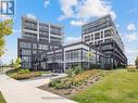 323 - 50 George Butchart Drive, Toronto, ON  - Outdoor With Facade 