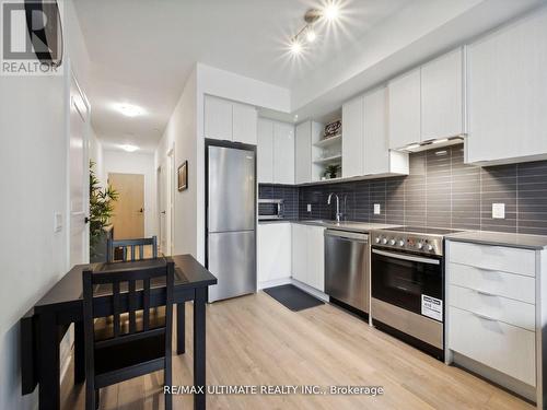 323 - 50 George Butchart Drive, Toronto, ON - Indoor Photo Showing Kitchen