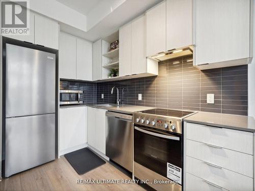 323 - 50 George Butchart Drive, Toronto, ON - Indoor Photo Showing Kitchen With Upgraded Kitchen