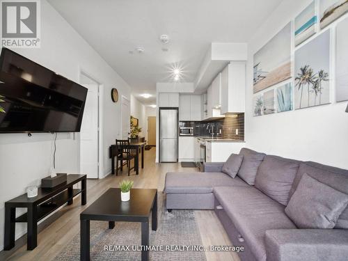 323 - 50 George Butchart Drive, Toronto, ON - Indoor Photo Showing Living Room