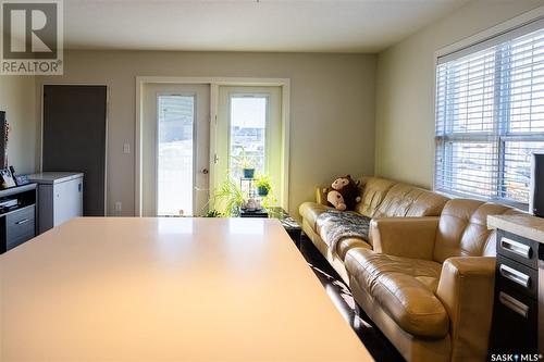 115 211 Ledingham Street, Saskatoon, SK - Indoor Photo Showing Living Room With Fireplace