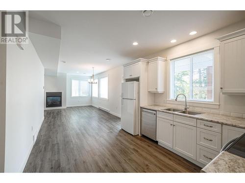 3300 16 Avenue Ne, Salmon Arm, BC - Indoor Photo Showing Kitchen With Fireplace With Double Sink