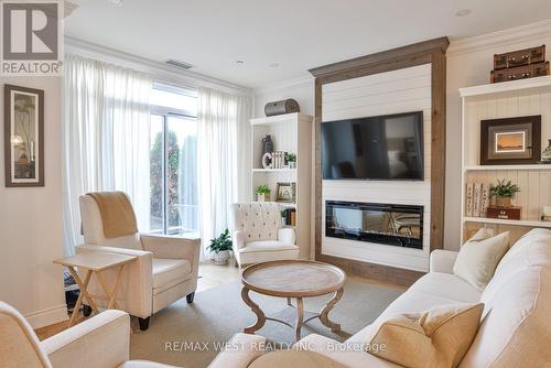 105 - 90 Orchard Point, Orillia, ON - Indoor Photo Showing Living Room With Fireplace