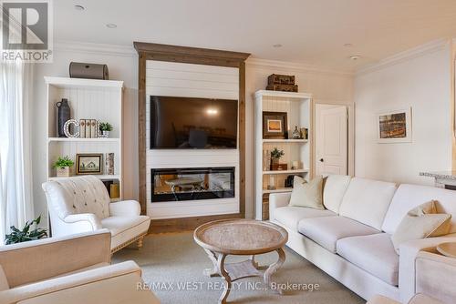 105 - 90 Orchard Point, Orillia, ON - Indoor Photo Showing Living Room With Fireplace