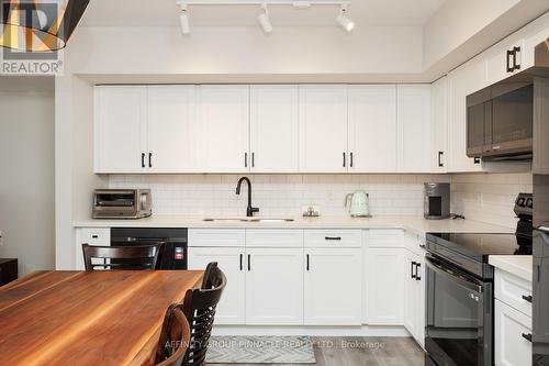 105 - 25 King Street, Kawartha Lakes (Lindsay), ON - Indoor Photo Showing Kitchen With Double Sink