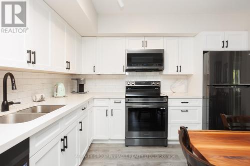 105 - 25 King Street, Kawartha Lakes (Lindsay), ON - Indoor Photo Showing Kitchen With Double Sink