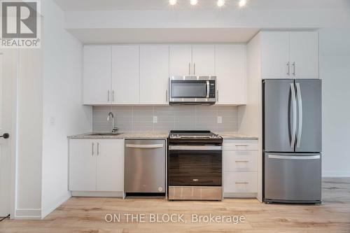 208 - 345 Wheat Boom Drive, Oakville, ON - Indoor Photo Showing Kitchen With Stainless Steel Kitchen