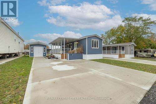 cement driveway parking for 3 - E40 - 4340 Cromarty Drive N, Thames Centre (Mossley), ON - Outdoor