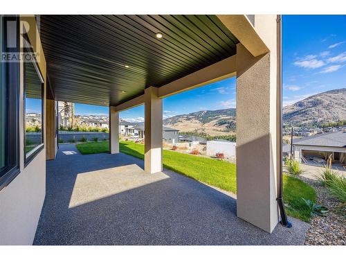 Lower covered patio - 989 Loseth Drive, Kelowna, BC - Outdoor With Deck Patio Veranda With Exterior