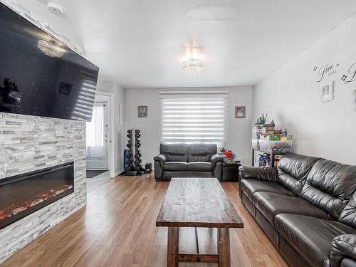 Living room - 990 9E Avenue, Laval (Fabreville), QC - Indoor Photo Showing Living Room With Fireplace