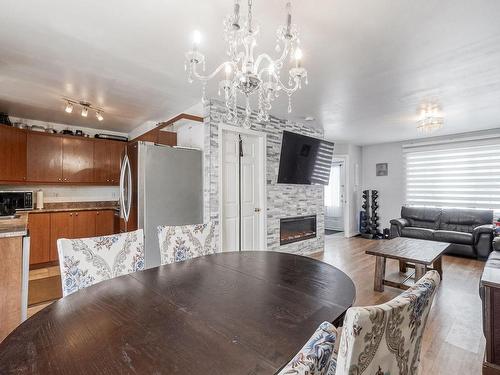 Dining room - 990 9E Avenue, Laval (Fabreville), QC - Indoor With Fireplace