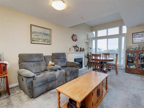 406-9840 Fifth St, Sidney, BC - Indoor Photo Showing Living Room With Fireplace