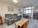 406-9840 Fifth St, Sidney, BC  - Indoor Photo Showing Living Room With Fireplace 