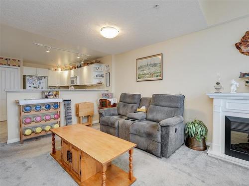 406-9840 Fifth St, Sidney, BC - Indoor Photo Showing Living Room With Fireplace