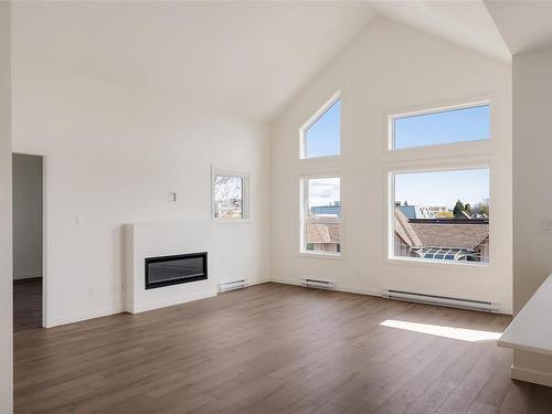 401-9716 Third St, Sidney, BC - Indoor Photo Showing Living Room With Fireplace