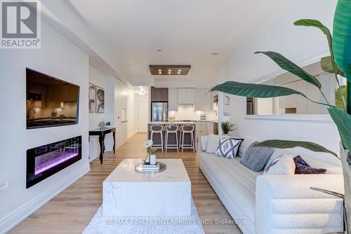 213 - 1 Hurontario Street, Mississauga, ON - Indoor Photo Showing Living Room With Fireplace