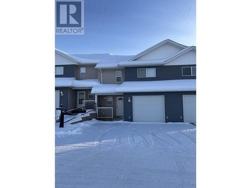 7 4620 E 52 Avenue, Fort Nelson, BC - Outdoor With Facade