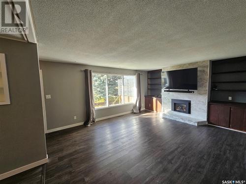 13 Mountain Drive, Carlyle, SK - Indoor Photo Showing Living Room With Fireplace