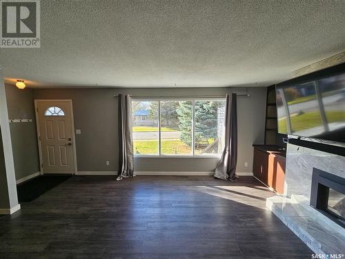 13 Mountain Drive, Carlyle, SK - Indoor Photo Showing Other Room With Fireplace