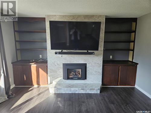 13 Mountain Drive, Carlyle, SK - Indoor Photo Showing Living Room With Fireplace