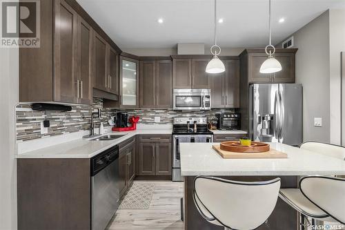 258 Maningas Bend, Saskatoon, SK - Indoor Photo Showing Kitchen With Double Sink With Upgraded Kitchen