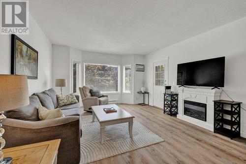 985 Klo Road Unit# 110 Lot# Lot 24, Kelowna, BC - Indoor Photo Showing Living Room With Fireplace