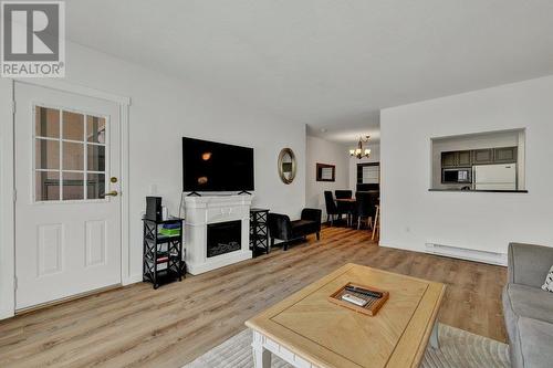 985 Klo Road Unit# 110 Lot# Lot 24, Kelowna, BC - Indoor Photo Showing Living Room With Fireplace