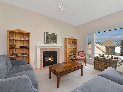 302-3969 Shelbourne St, Saanich, BC - Indoor Photo Showing Living Room With Fireplace