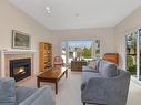 302-3969 Shelbourne St, Saanich, BC  - Indoor Photo Showing Living Room With Fireplace 