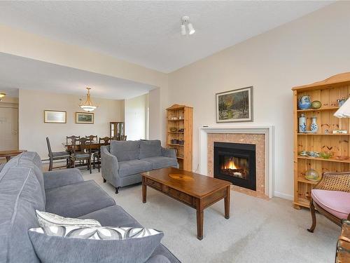 302-3969 Shelbourne St, Saanich, BC - Indoor Photo Showing Living Room With Fireplace