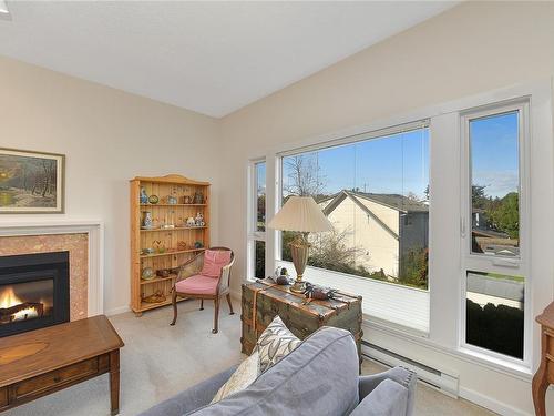 302-3969 Shelbourne St, Saanich, BC - Indoor Photo Showing Living Room With Fireplace