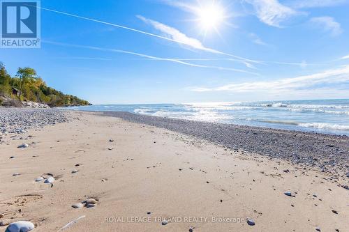 Secluded & sprawling sandy beach, photo'd Oct 2024 - 73952 Durand Street, Bluewater (Zurich), ON - Outdoor With Body Of Water With View