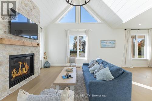 Lakeview living room w/ vaulted celings & gas FP. - 73952 Durand Street, Bluewater (Zurich), ON - Indoor Photo Showing Living Room With Fireplace