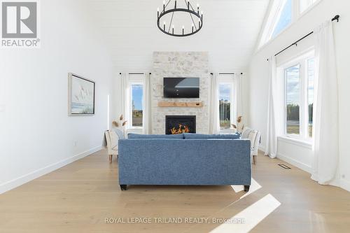 Lakeview living room w/ vaulted celings & gas. FP - 73952 Durand Street, Bluewater (Zurich), ON - Indoor Photo Showing Other Room With Fireplace