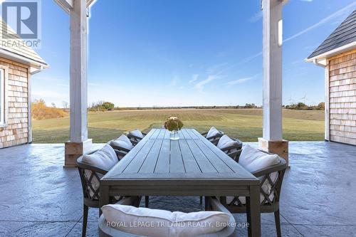 Outdoor dining area overlooking rolling pastures. - 73952 Durand Street, Bluewater (Zurich), ON - Outdoor