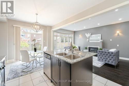 27 Dunedin Drive, Vaughan, ON - Indoor Photo Showing Kitchen With Fireplace With Double Sink With Upgraded Kitchen