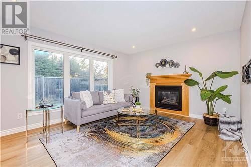 122 Whernside Terrace, Kanata, ON - Indoor Photo Showing Living Room With Fireplace