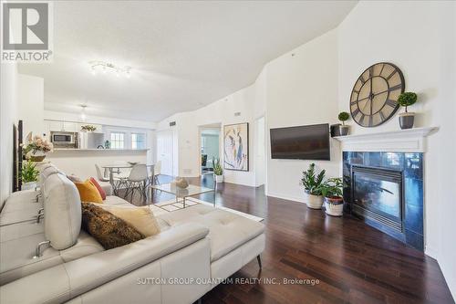 411 - 1370 Main Street E, Milton, ON - Indoor Photo Showing Living Room With Fireplace