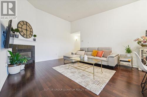 411 - 1370 Main Street E, Milton, ON - Indoor Photo Showing Living Room With Fireplace