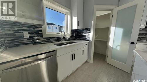 714 Delainey Court, Saskatoon, SK - Indoor Photo Showing Kitchen With Double Sink With Upgraded Kitchen