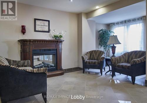 105 - 61 Clarington Boulevard N, Clarington (Bowmanville), ON - Indoor With Fireplace